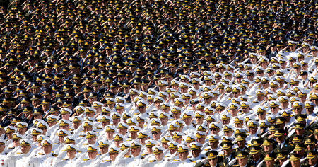 Turkish soldiers salute during a ceremony marking the 87th anniversary of Victory Day at the mausoleum of Mustafa Kemal Ataturk, founder of modern Turkey, in Ankara, Turkey, August 30, 2009. REUTERS/Umit Bektas/File photo