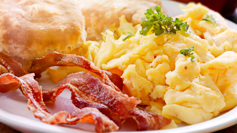 Biscuits with scrambled eggs and bacon
