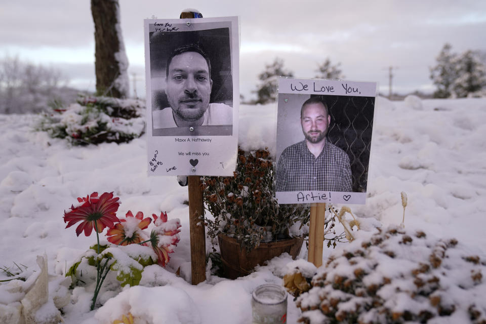 Pictures of two of the victims of last month's mass shooting in Lewiston, Maine, are seen at a makeshift memorial, Tuesday, Dec. 5, 2023. With winter approaching, officials began removing memorials to the 18 people killed. Items will be preserved at a local museum. (AP Photo/Robert F. Bukaty)
