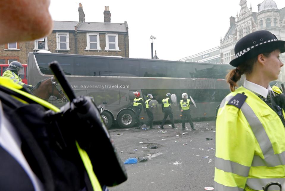 Britain Soccer Football - West Ham United v Manchester United - Barclays Premier League - Upton Park - 10/5/16 General view as bottles are thrown at the Manchester United team bus before the match Reuters / Eddie Keogh Livepic EDITORIAL USE ONLY. No use with unauthorized audio, video, data, fixture lists, club/league logos or "live" services. Online in-match use limited to 45 images, no video emulation. No use in betting, games or single club/league/player publications. Please contact your account representative for further details.