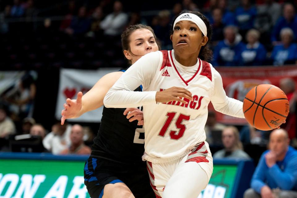 Princeton guard Sole Williams (15) drives past Midview guard Olivia DiFranco (20) in the OHSAA Division I state semifinal game on March 9.