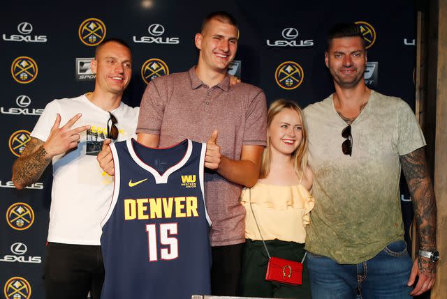 David Zalubowski/AP Nikola Jokic, of Serbia, with his girlfriend, Natalija Macesic, and his brothers in 2018