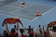 Novak Djokovic and Viktor Troicki of Serbia react during the tournament against Pablo Carreno Busta and Feliciano Lopez of Spain during their ATP Cup tennis match in Sydney, early Monday, Jan. 13, 2020. (AP Photo/Steve Christo)