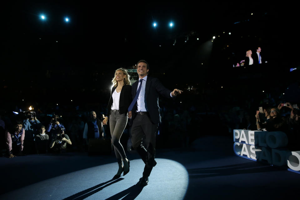 Popular Party's candidate Pablo Casado, right, and Cayetana Alvarez de Toledo arrive for the closing election campaign event in Madrid, Spain, Friday, April 26, 2019. Appealing to Spain's large pool of undecided voters, top candidates on both the right and left are urging Spaniards to choose wisely and keep the far-right at bay in Sunday's general election. (AP Photo/Andrea Comas)