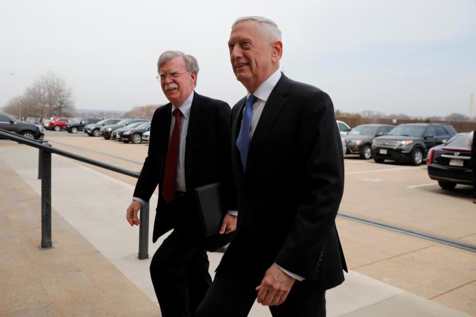 The US secretary of defense, James Mattis, greets John Bolton as he arrives at the Pentagon.