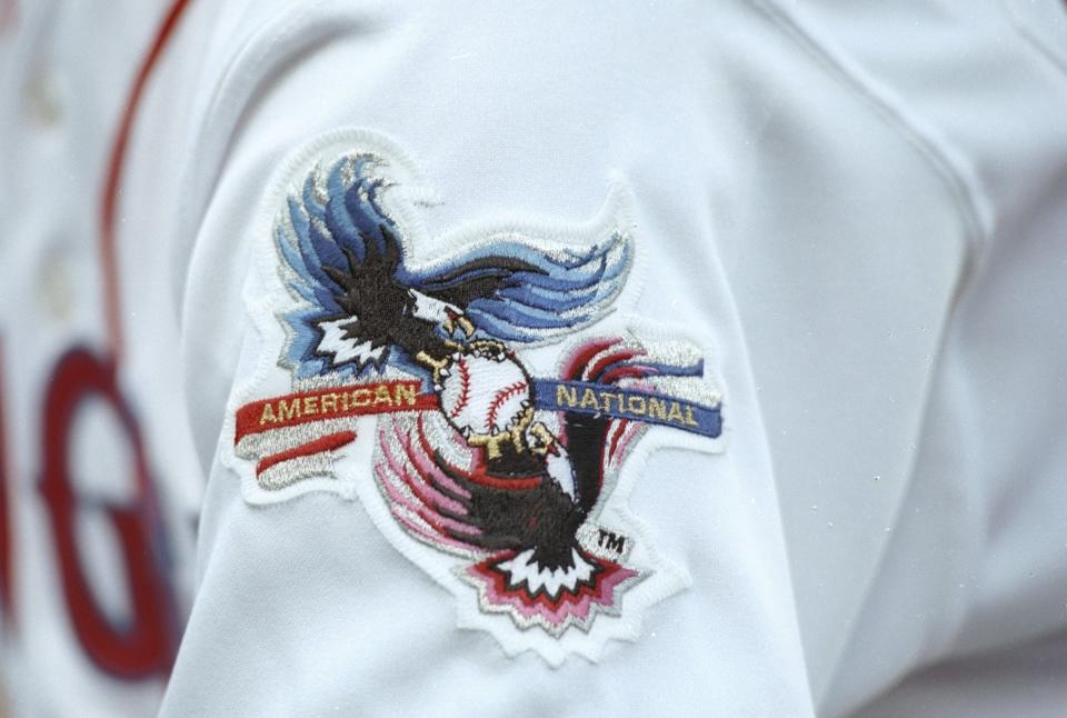 Players wore patches representing the AL and NL in MLB's first interleague games. (Stephen Dunn/Allsport via Getty Images)