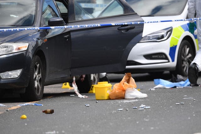 Police at the scene of a shooting in Roydon, Harlow