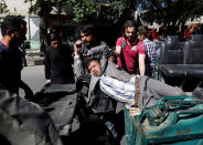 <p>Men move an injured man to a hospital after a blast in Kabul, Afghanistan May 31, 2017. (Mohammad Ismail/Reuters) </p>