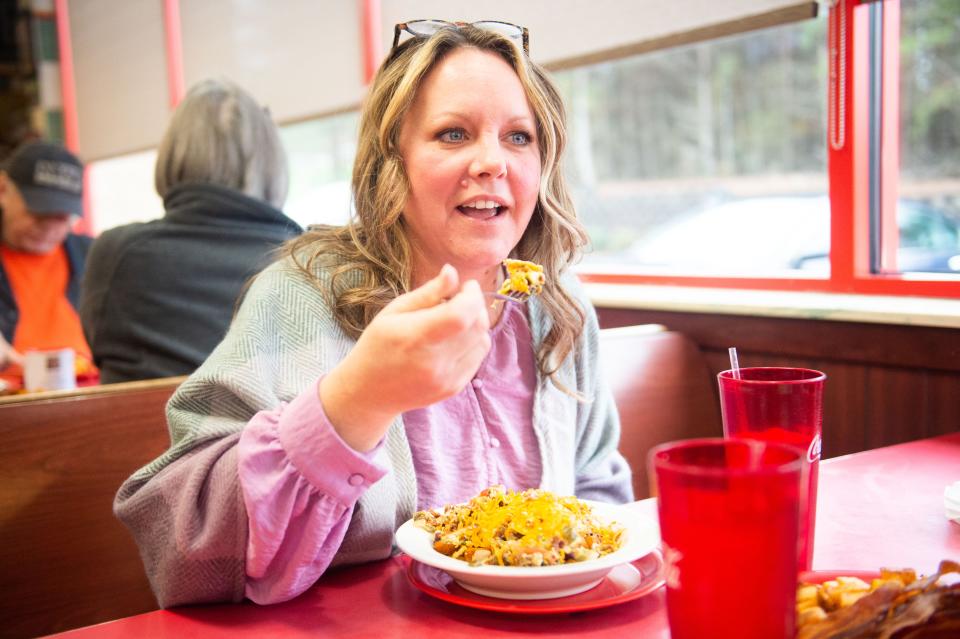 Julie Limbaugh enjoys a bite from her egg bowl at Nick and J's Cafe in Knoxville on Jan. 26.