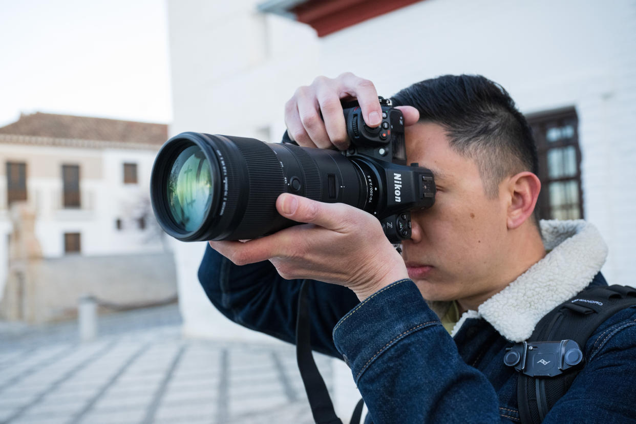  Photographer with the Nikon Z8 in the hand and viewfinder held up to the eye  