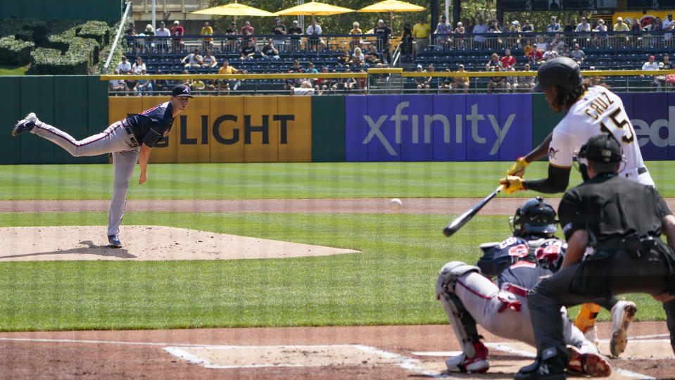 Atlanta Braves starter Kyle Wright, left, pitches to Pittsburgh Pirates' Oneil Cruz during the first inning of a baseball game, Wednesday, Aug. 24, 2022, in Pittsburgh. (AP Photo/Keith Srakocic)