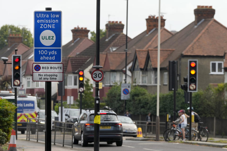 A road sign marks the entrance to the Ultra Low Emission Zone (ULEZ) in London, Thursday, Aug. 24, 2023. London’s traffic cameras are under attack. Police say hundreds of license plate-reading cameras have been damaged, disconnected or stolen by opponents of an anti-pollution charge on older vehicles that comes into force across the metropolis on Tuesday. The vandalism is a sign of how high emotions are running over the Ultra Low Emission Zone. (AP Photo/Frank Augstein)