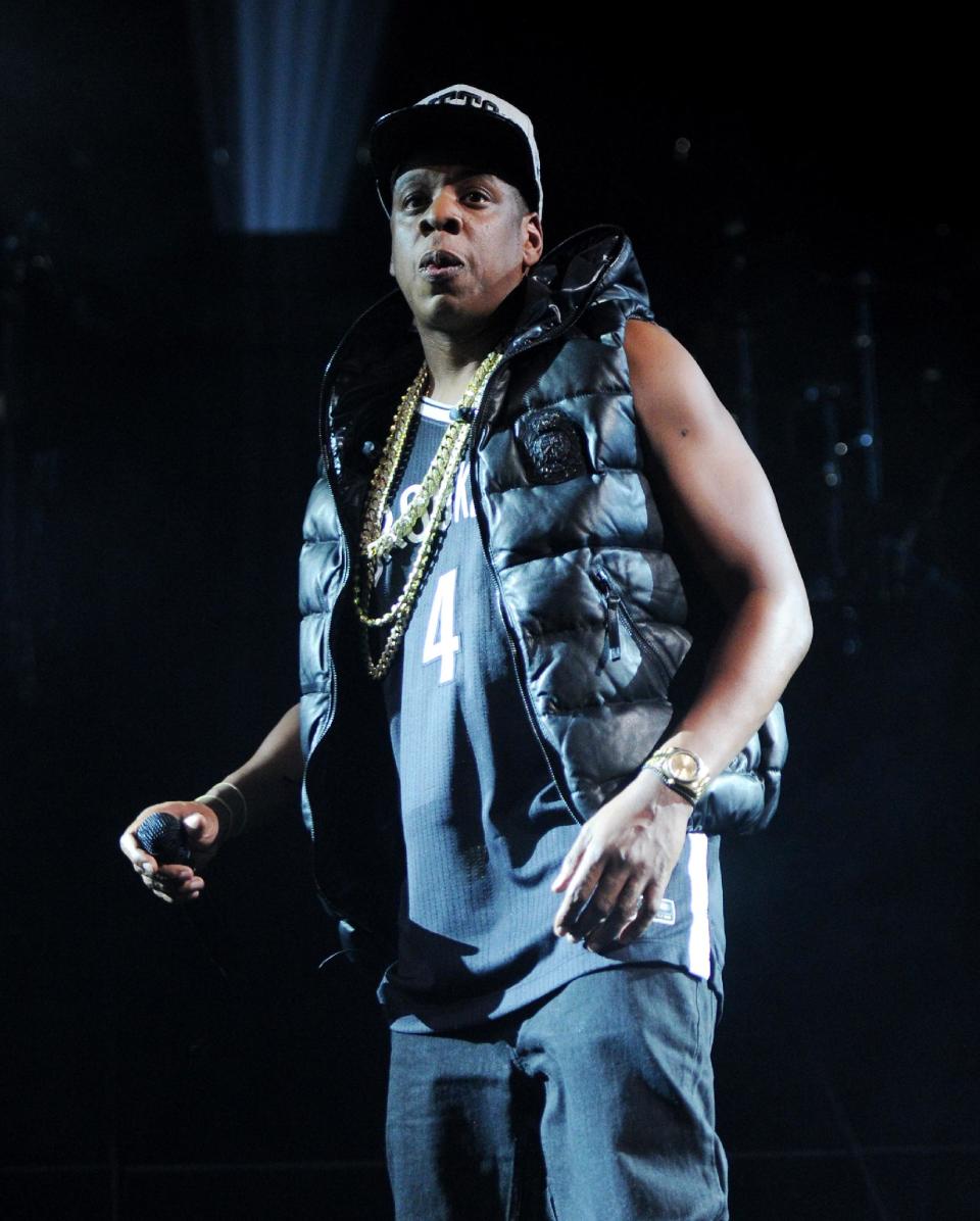 FILE - In this Sept. 28, 2012 file photo, Jay-Z performs the inaugural concert at the Barclays Center in Brooklyn, in New York. The rapper released his 12th album, “Magna Carta Holy Grail,” three days early on Thursday, July 4, 2013, through a deal with Samsung. The album is officially out Sunday and features Justin Timberlake, Beyonce, Frank Ocean and Timbaland. (Photo by Evan Agostini/Invision/AP, File)