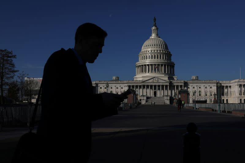 A person walks past the U.S. Capitol in Washington