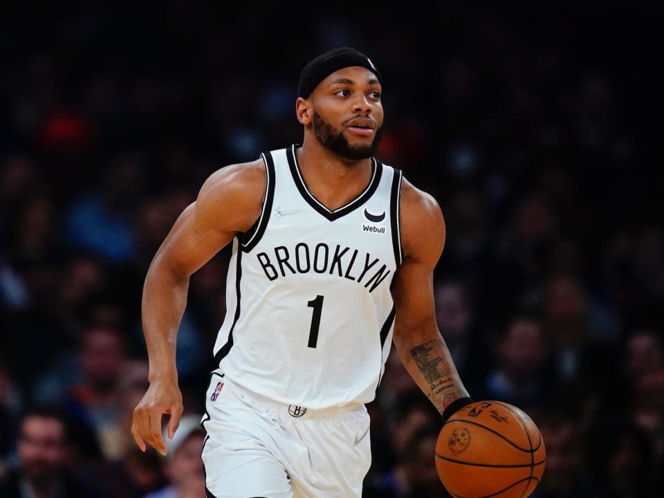 Bruce Brown dribbles the ball up the court during a game.