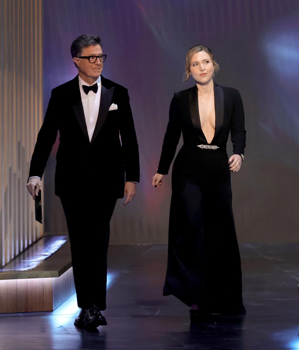 Stephen Colbert and Taylor Tomlinson present at the 75th Primetime Emmy Awards on January 15.