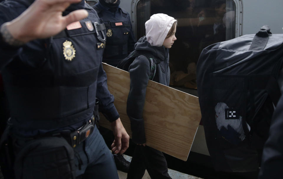 Climate activist Greta Thunberg arrives in Madrid on Friday Dec. 6, 2019. Climate activist Greta Thunberg has arrived by train in Madrid, where a global U.N.-sponsored climate change conference is underway. The Swedish teen is scheduled to join thousands of other youth later on Friday in a march to demand negotiators and politicians real action in tackling the planet's rising temperatures. (AP Photo/Andrea Comas)