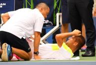 Sept 2, 2016; New York, NY, USA; Mikhail Youzhny of Russia gets treatment on court while playing Novak Djokovic of Serbia on day five of the 2016 U.S. Open tennis tournament at USTA Billie Jean King National Tennis Center. Robert Deutsch-USA TODAY Sports