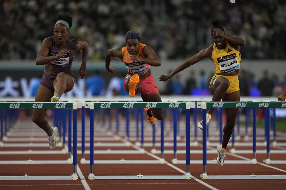 Jasmine Camacho-Quinn of Puerto Rico, left, Deyynne Charlton of the Bahamas, centre, and Danielle Williams of Jamaica compete in the 100-meters women's hurdles during the Diamond League event held in Suzhou in eastern China's Jiangsu province Saturday, April 27, 2024. (AP Photo/Ng Han Guan)