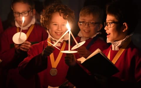 Choristers sang carols as the lights on the tree were switched on - Credit: RUSSELL SACH