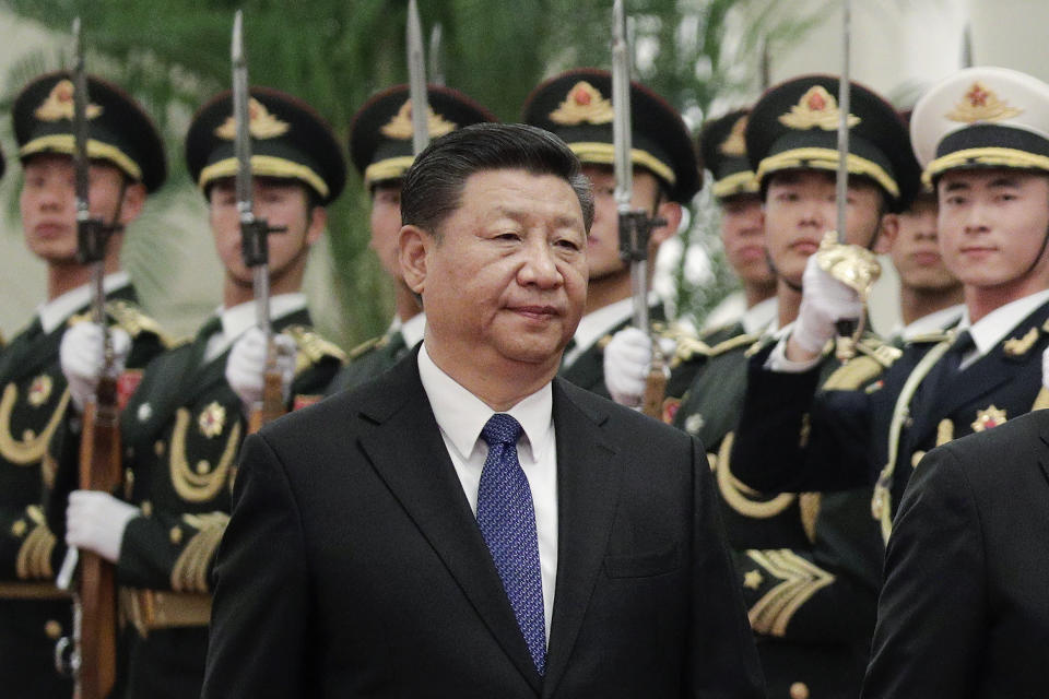 FILE - Chinese President Xi Jinping and Finnish President Sauli Niinisto (unseen) review an honor guard at the Great Hall of the People in Beijing, Monday, Jan. 14, 2019. With Russia’s military failings in Ukraine mounting, no country is paying closer attention than China to how a smaller, outgunned force has badly bloodied what was thought to be one of the world’s strongest armies. (AP Photo/Andy Wong, File)