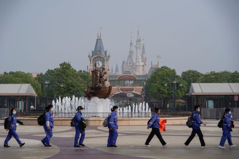Staff is seen at Shanghai Disney Resort as the Shanghai Disneyland theme park reopens following a shutdown due to the coronavirus disease (COVID-19) outbreak, in Shanghai
