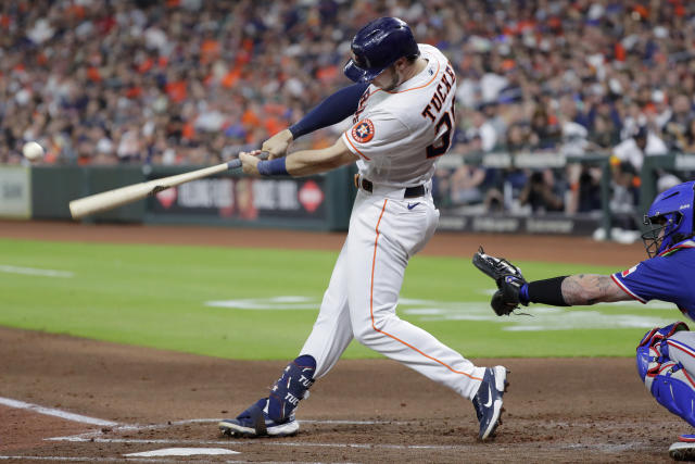 Milwaukee Brewers' Jesús Aguilar (24) flips his bat as he walks in the  second inning of a spring training baseball game against the Texas Rangers,  Tuesday, March 19, 2019, in Phoenix (AP