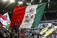 Football Soccer - Juventus v Carpi - Italian Serie A - Juventus stadium, Turin, Italy - 01/05/16 Juventus' supporters wave their flags during the match against Carpi. REUTERS/Stefano Rellandini