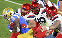 UCLA running back Demetric Felton carries against Arizona during the first half of an NCAA college football game Saturday, Nov. 28, 2020, in Pasadena, Calif. (Keith Birmingham/The Orange County Register via AP)