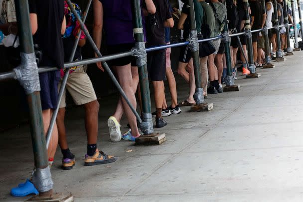 PHOTO: People wait in line to recieve the Monkeypox vaccine before the opening of a new mass vaccination site at the Bushwick Education Campus in Brooklyn on July 17, 2022. (Kena Betancur/AFP via Getty Images)