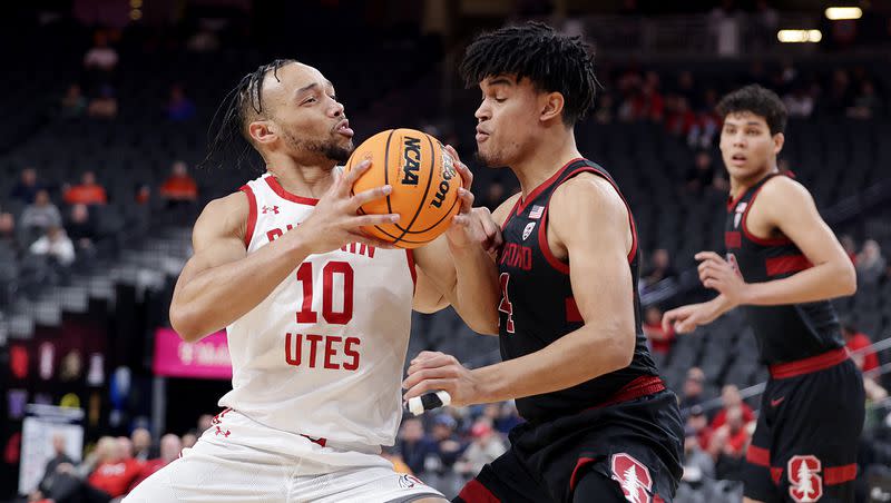 Utah guard Marco Anthony drives on Stanford forward Spencer Jones in Pac-12 tournament action at T-Mobile Arena in Las Vegas on Wednesday, March 8, 2023. Stanford won 73-62.
