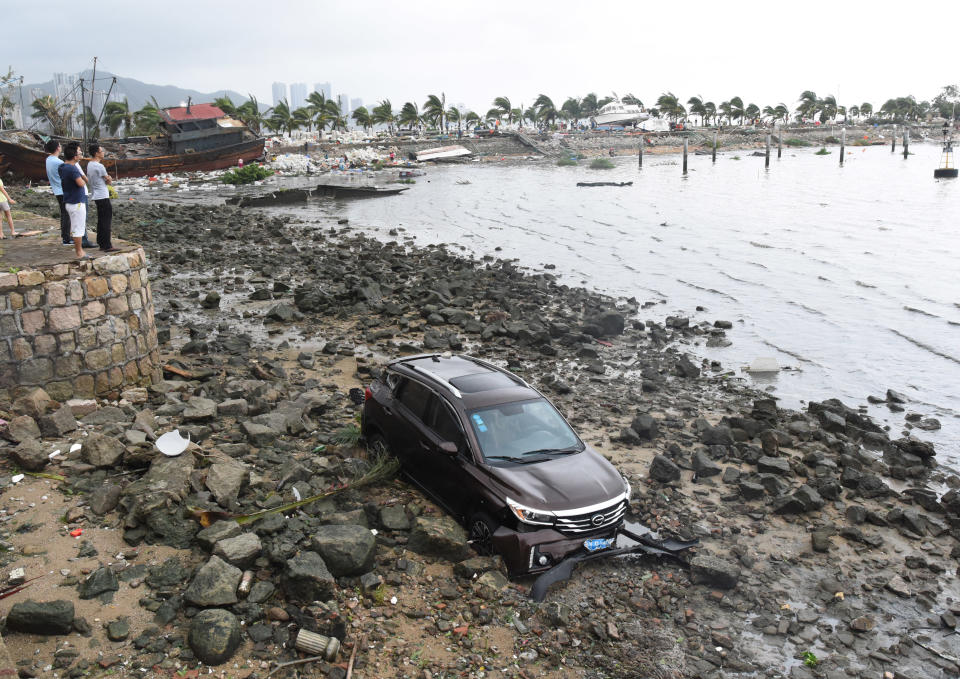 <p>A car is swept away from road in Zhuhai, south China’s Guangdong Province, Aug. 23, 2017. (Photo: Lu Hanxin/Xinhua via ZUMA Wire) </p>