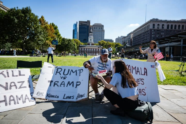 A supporter of former US president and Republican presidential nominee Donald Trump sits outside of the National Constitution Center, ahead of the presidential debate (andrew thomas)