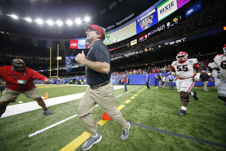 Georgia coach Kirby Smart runs onto the field before the team's Sugar Bowl NCAA college football game against Baylor in New Orleans, Wednesday, Jan. 1, 2020. (AP Photo/Gerald Herbert)