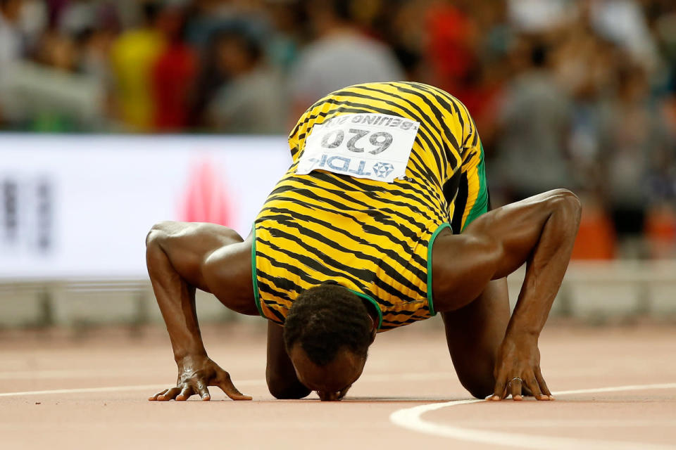 <p>The Jamaican runner famously kissed the track after winning the 100m and 200m races in record times at the London Summer Games in August 2012. <i>[Photo: Getty]</i></p>