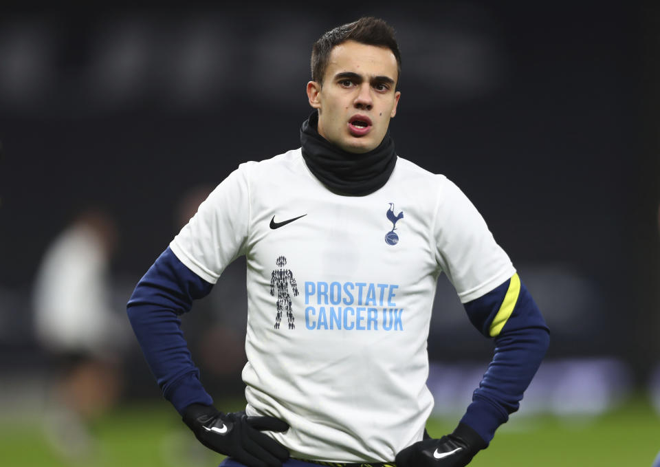 FILE - In this Saturday, Nov. 21, 2020 file photo, Tottenham's Sergio Reguilon warms up ahead of their English Premier League soccer match against Manchester City at Tottenham Hotspur Stadium in London. Four Premier League players from Tottenham and West Ham have broken English lockdown laws by gathering inside a house together over Christmas just after the government had tightened coronavirus restrictions in response to a new transmissible variant. Tottenham and West Ham on Saturday, Jan. 2, 2021 condemned the inter-household mixing by their players, Tottenham trio Erik Lamela, Sergio Reguilon and Giovani Lo Celso and West Ham’s Manuel Lanzini and other people. (Clive Rose/Pool via AP)