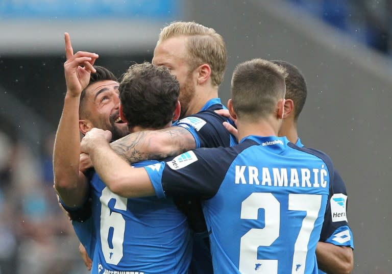 Hoffenheim's Kerem Demirbay (L) celebrates scoring against Borussia Moenchengladbach in Sinsheim, southern Germany, on April 15, 2017