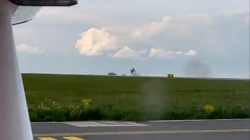 A dramatic emergency landing Sunday caught on video shows part of a plane's landing gear snap off during touchdown in Luxembourg on May 14, 2023.