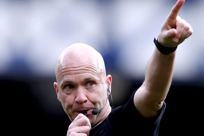 Referee Anthony Taylor gestures during the Premier League match between <a class="link " href="https://sports.yahoo.com/soccer/teams/everton/" data-i13n="sec:content-canvas;subsec:anchor_text;elm:context_link" data-ylk="slk:Everton FC;sec:content-canvas;subsec:anchor_text;elm:context_link;itc:0">Everton FC</a> and <a class="link " href="https://sports.yahoo.com/soccer/teams/nottingham/" data-i13n="sec:content-canvas;subsec:anchor_text;elm:context_link" data-ylk="slk:Nottingham Forest;sec:content-canvas;subsec:anchor_text;elm:context_link;itc:0">Nottingham Forest</a> at Goodison Park on April 21, 2024 -Credit:Photo by Alex Livesey/Getty Images