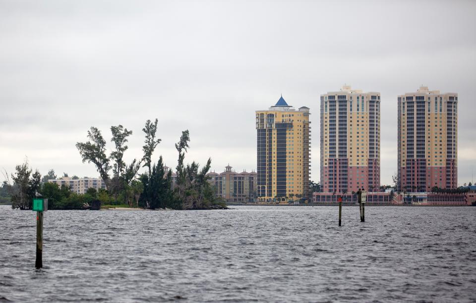 Legacy Island, also known as Clint's Island or Rat Island, is set to become a park. It is in the Caloosahatchee River just east of the Edison Bridge in Fort Myers. The Beau Rivage, St. Tropez and Riviera condo buildings rise in the background.