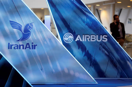 FILE PHOTO: The logos of Airbus group and IranAir are pictured the company IranAir takes delivery of the first new Western jet, an Airbus A321, under an international sanctions deal in Colomiers, near Toulouse, France, January 11, 2017. REUTERS/Regis Duvignau/File Photo