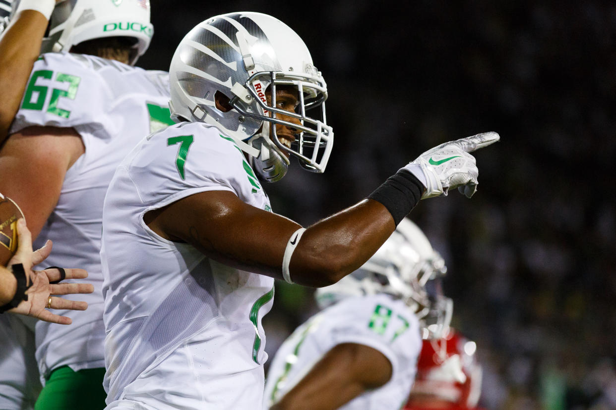 Oregon wide receiver Keanon Lowe (7) points to one of his teammates during the second quarter of an NCAA college football game in Eugene, Ore., Saturday, Aug. 30, 2014 (AP Photo/Ryan Kang)