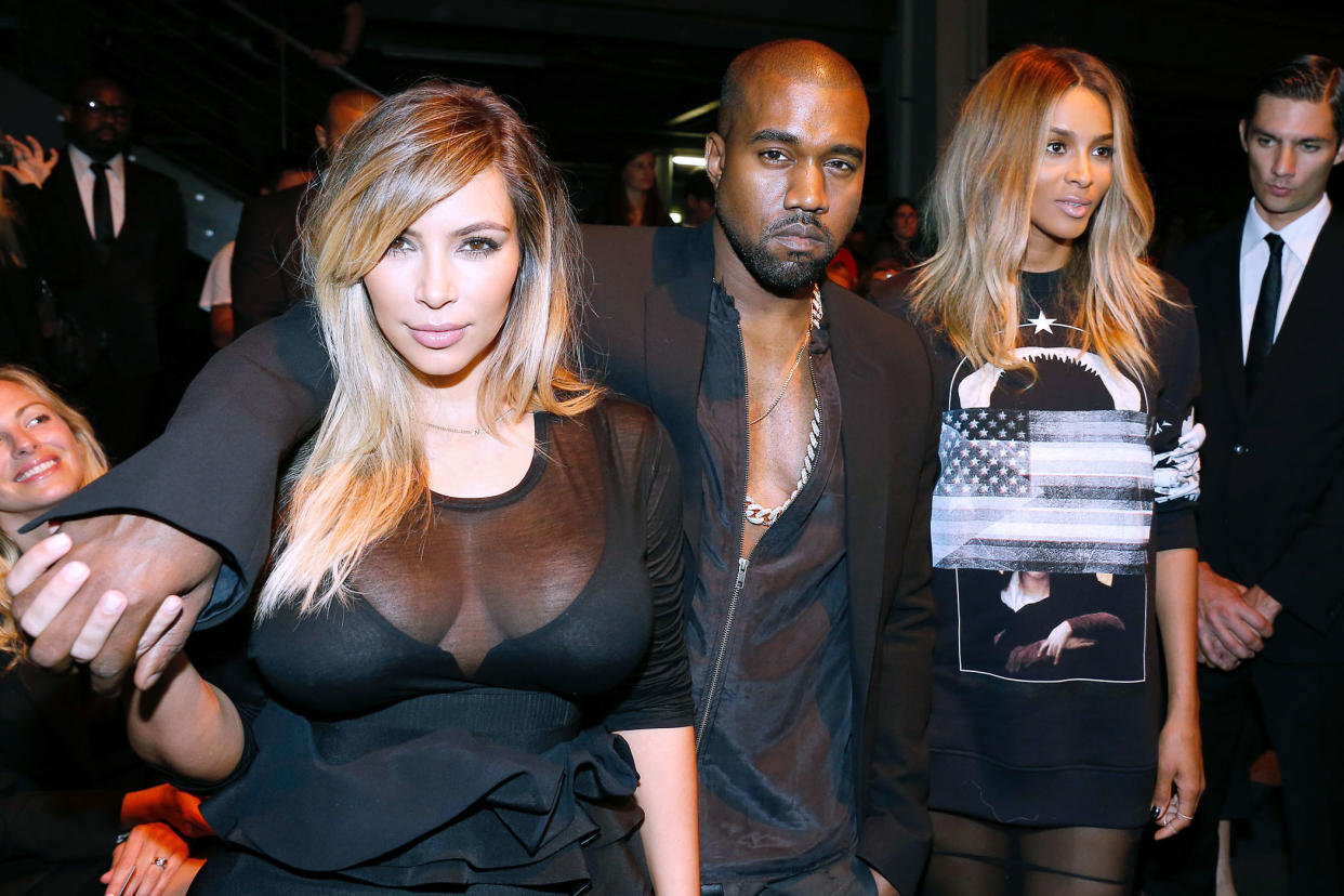 PARIS, FRANCE - SEPTEMBER 29:  Kim Kardashian, Kanye West and singer Ciara attend Givenchy show as part of the Paris Fashion Week Womenswear  Spring/Summer 2014, held at 'la Halle Freyssinet' on September 29, 2013 in Paris, France.  (Photo by Bertrand Rindoff Petroff/Getty Images)
