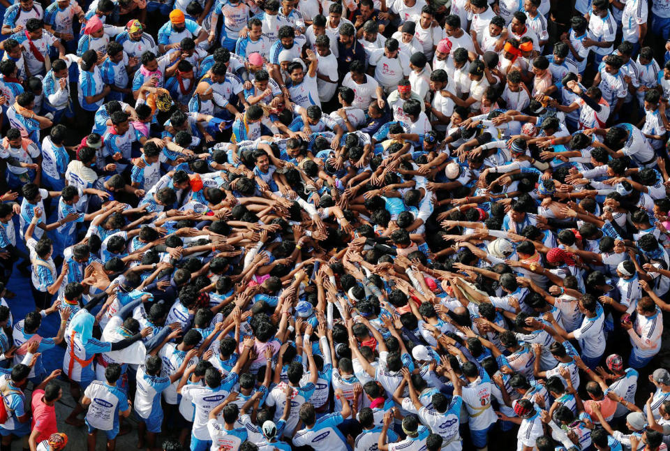 <p>Devotees form a human pyramid to celebrate the festival of Janmashtami, marking the birth anniversary of Hindu Lord Krishna, in Mumbai, India Aug. 25, 2016. (Photo: Shailesh Andrade/Reuters) </p>