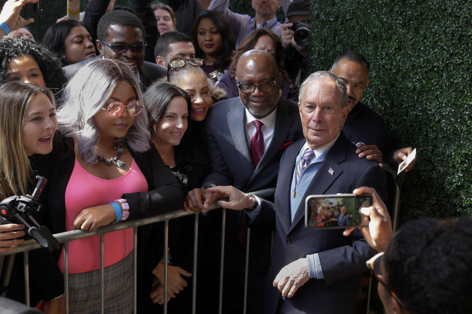 Democratic presidential candidate former New York City Mayor Mike Bloomberg poses for a photograph as he greets people during a campaign event at The Rustic Restaurant, Thursday, February 27, 2020, in Houston. (AP Photo/Michael Wyke)