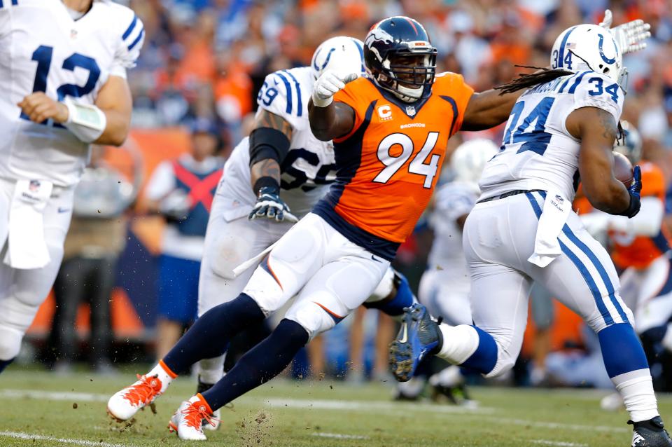 Denver Broncos defensive end DeMarcus Ware (94) competes against the Indianapolis Colts during the first half of an NFL football game, Sunday, Sept. 7, 2014, in Denver. (AP Photo/Jack Dempsey) 
