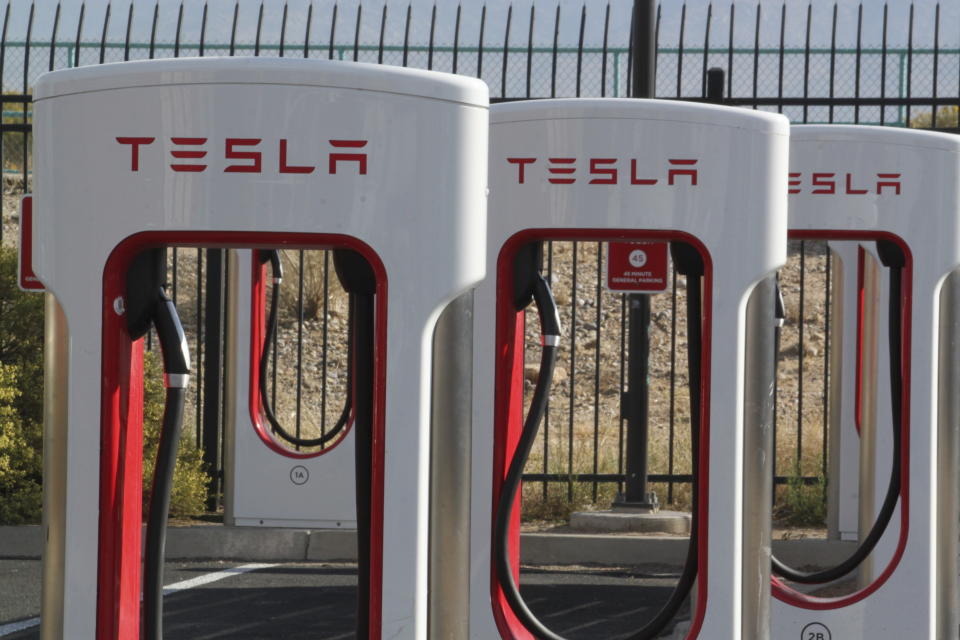 A Tesla charging station sits idle in Albuquerque, New Mexico, on Wednesday, Nov. 15, 2023. The New Mexico Environmental Improvement Board and the Albuquerque-Bernalillo County Air Quality Control Board adopted rules that will ramp up the percentage of electric vehicle deliveries by auto manufacturers to New Mexico dealerships after a joint public hearing wrapped up Thursday, Nov. 16, 2023. (AP Photo/Susan Montoya Bryan)