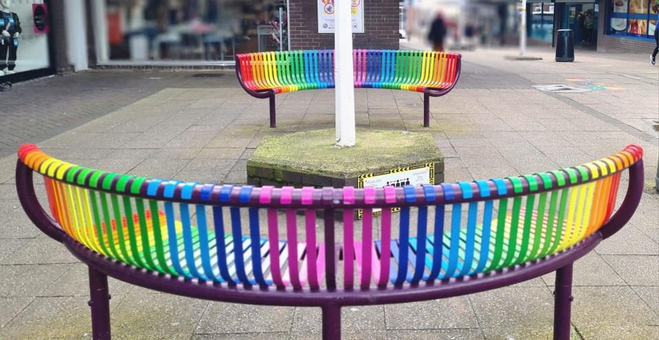 PIC FROM KENNEDY NEWS AND MEDIA (PICTURED: PICTURES OF THE RAINBOW-COLOURED 'BUDDY' BENCHES) Furious shoppers have branded a shopping centre's rainbow-coloured benches 'woke' - and are even threatening to paint them black. Longton Exchange Shopping Centre in Stoke-on-Trent unveiled two rainbow-coloured 'buddy' benches in May in a bid to combat loneliness. Shoppers are encouraged to take a seat on one of the 'Buddy Benches' to show they either need a chat or are open to having a conversation with someone else. DISCLAIMER: While Kennedy News and Media uses its best endeavours to establish the copyright and authenticity of all pictures supplied, it accepts no liability for any damage, loss or legal action caused by the use of images supplied and the publication of images is solely at your discretion. SEE KENNEDY NEWS COPY - 0161 697 4266