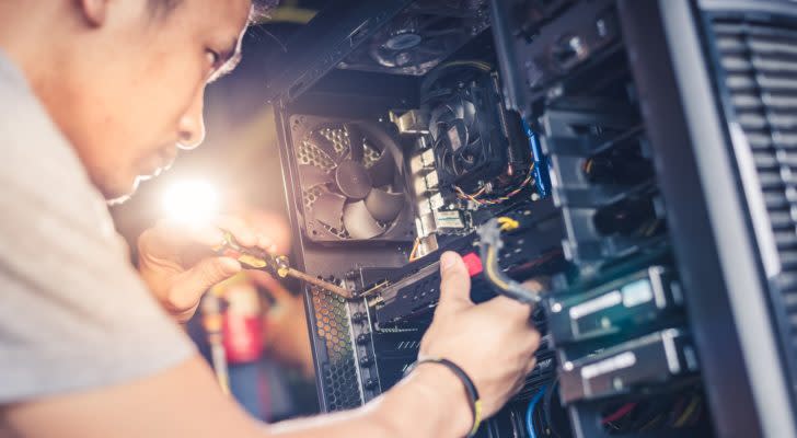 a man working on a computer hard drive