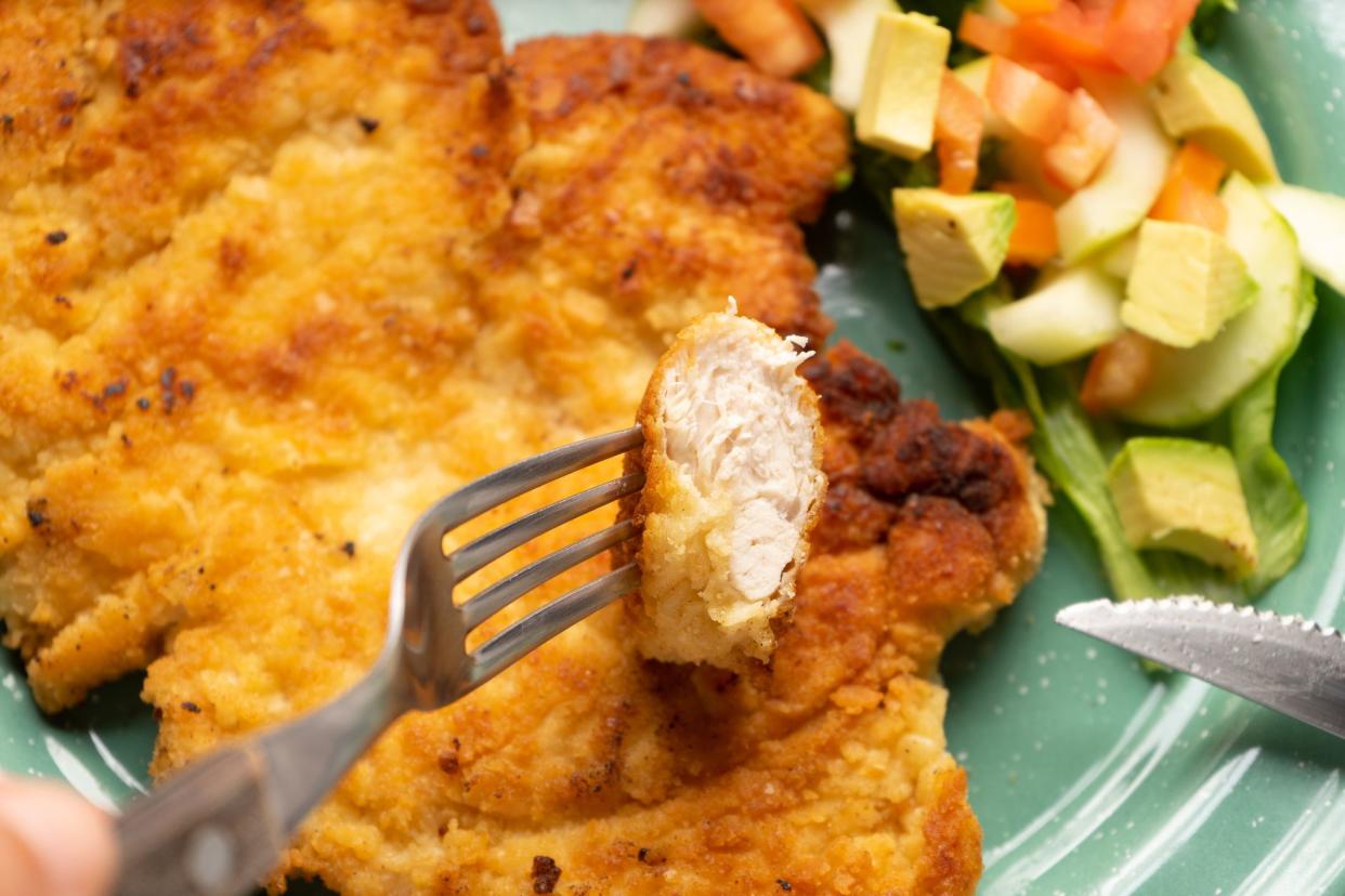 Crispy chicken breast fillets with salad. Healthy food
